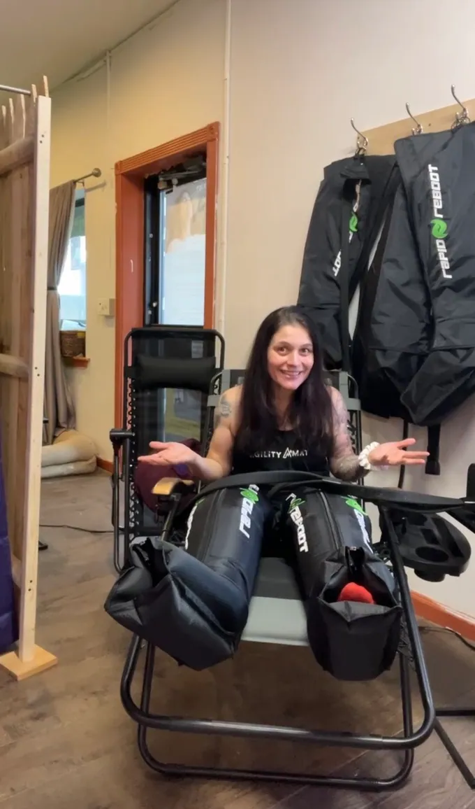 A member reclining in the compression therapy boots